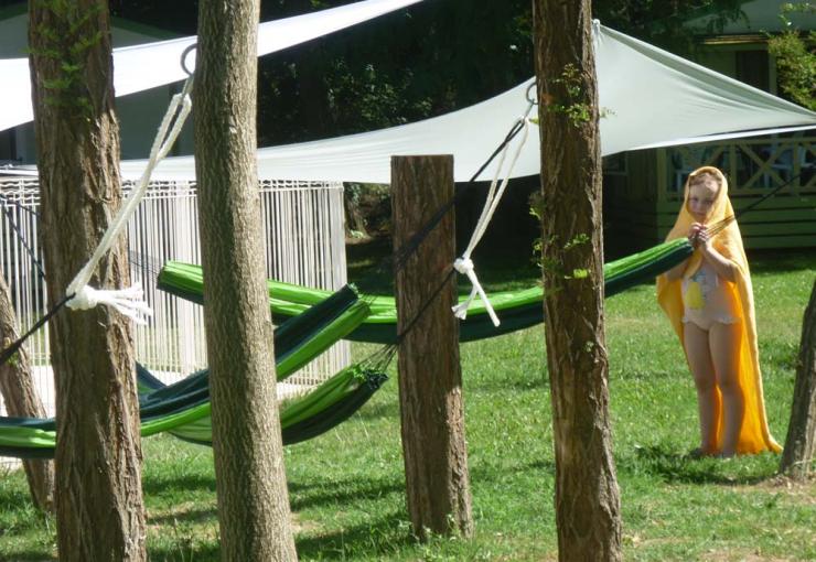 hammocks next to the swimming pool